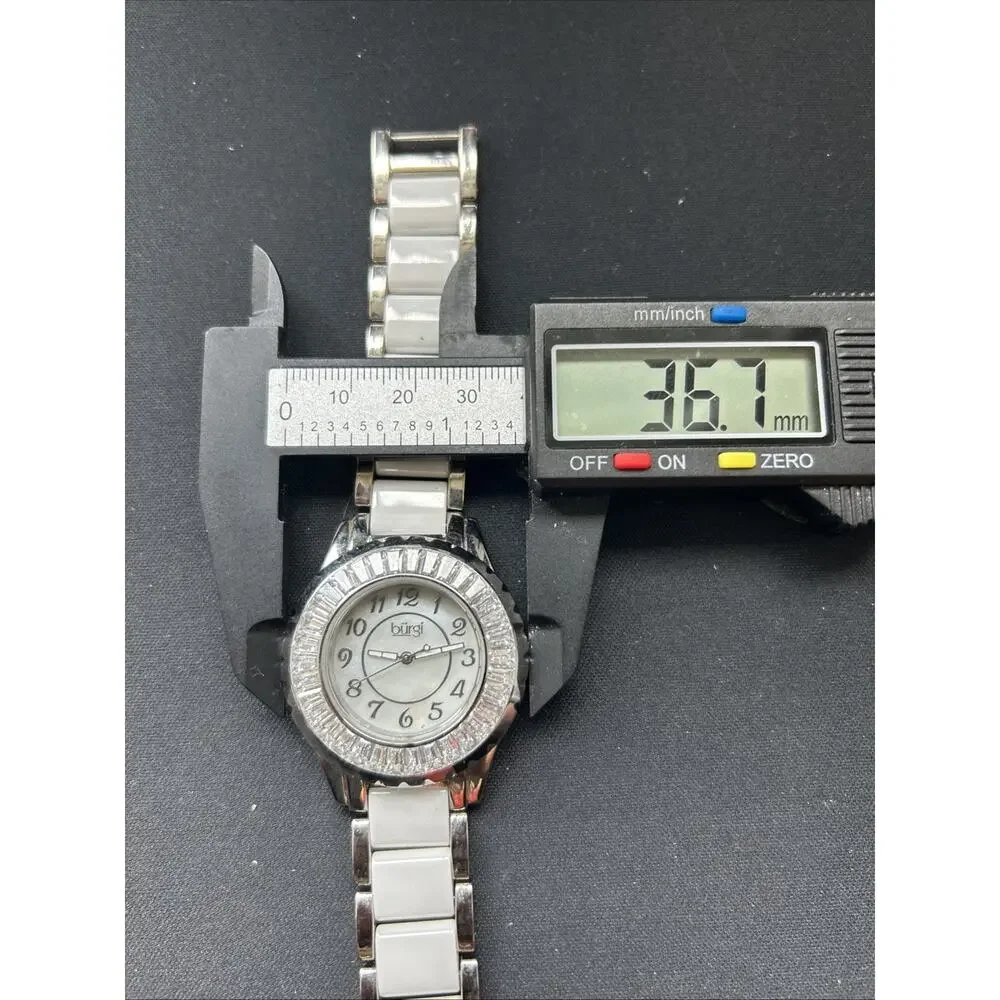 Burgi White And Silver Tone Rhinestone Bezel Women’s Quartz Watch